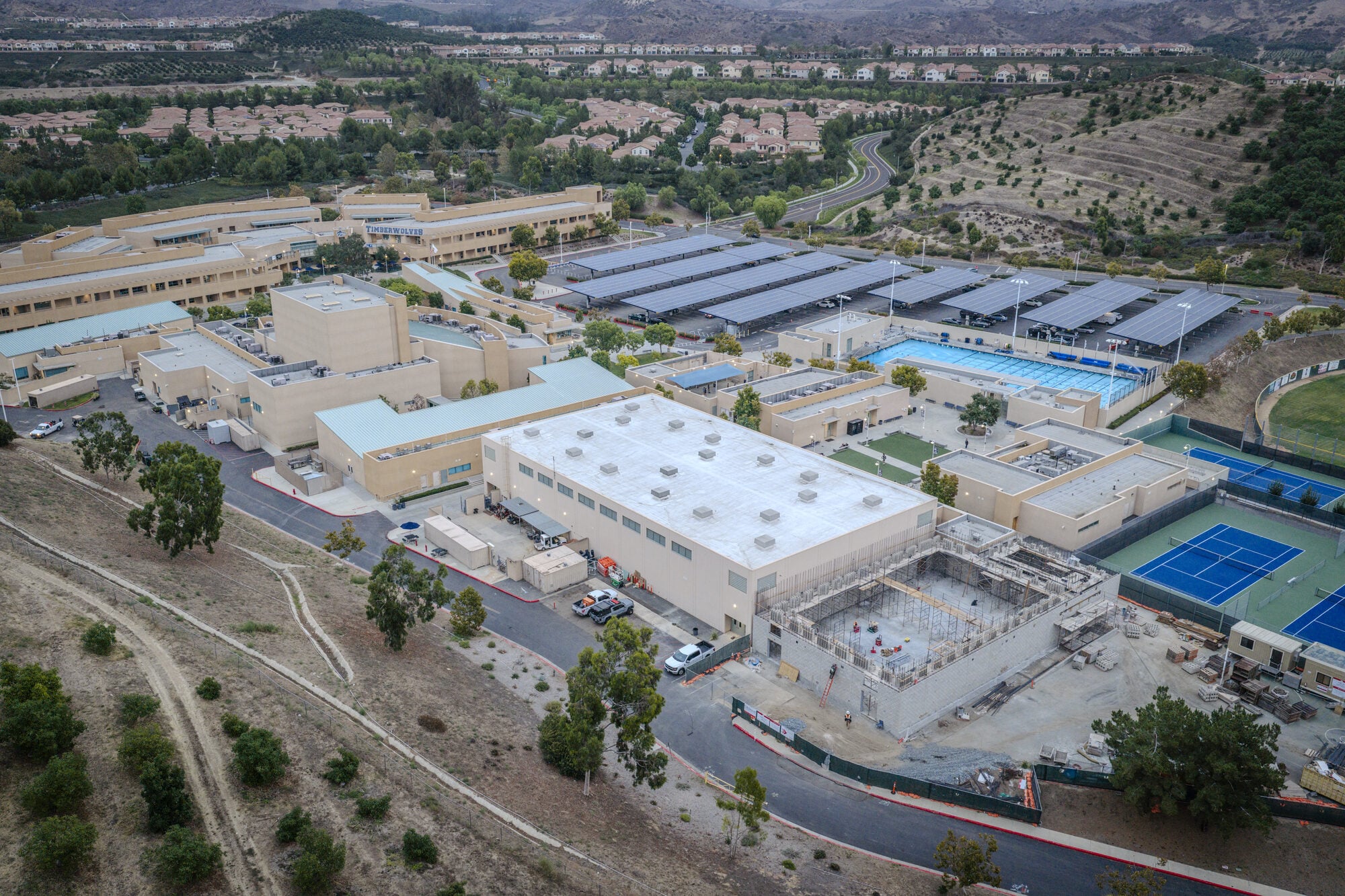 Aerial view of the gymnasium addition beside the existing athletic facilities